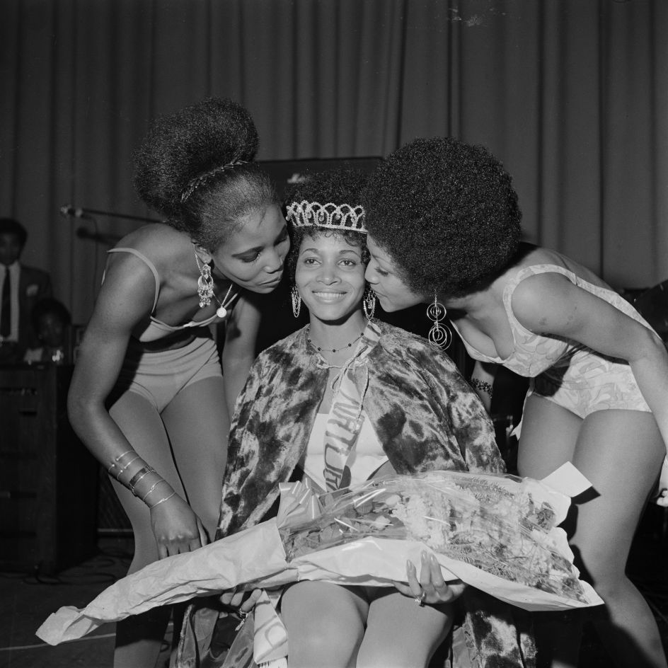 'Miss Black & Beautiful Rhona Williams with fellow contestants, Hammersmith Palais, London, 1970s. From the portfolio 'Black Beauty Pageants'. Courtesy of © Raphael Albert/Autograph ABP